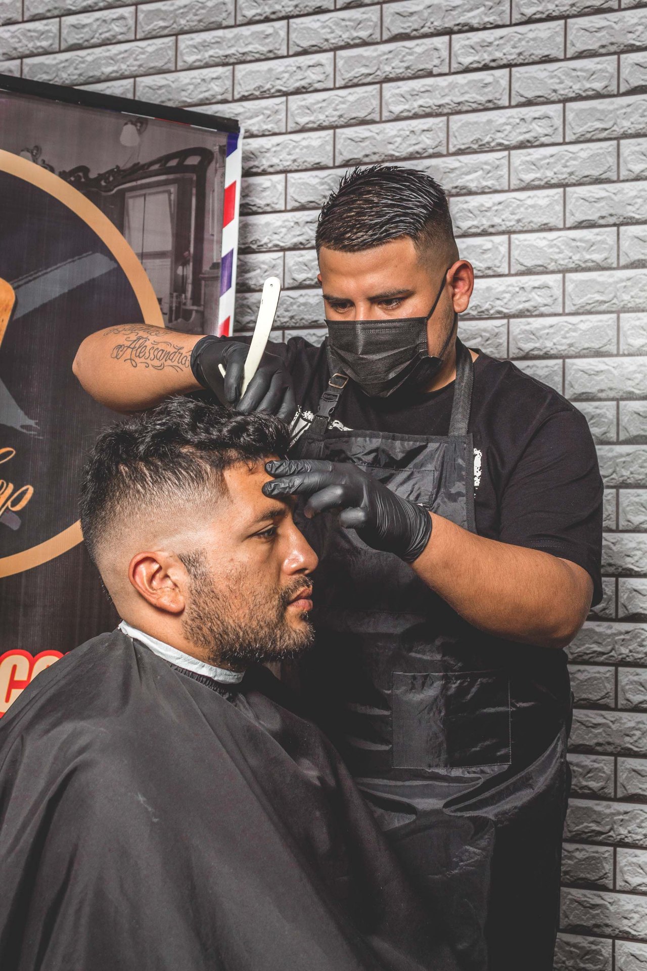 Barber cutting a client's hair
